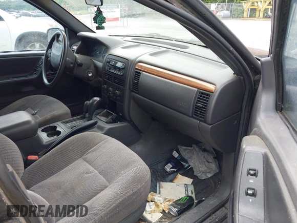 1999 Jeep Grand Cherokee Laredo with VIN 1J4GW58S0XC524798, listed as a IAAI auction lot 42761040 with 173,792 mi miles and . Bid and sale history available at DreamBid. Image 5.