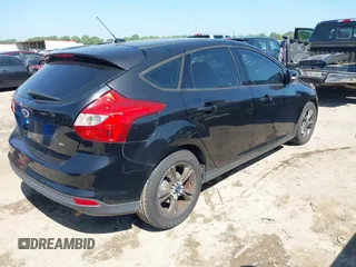 2014 Ford Focus SE with VIN 1FADP3K29EL273107, listed as a IAAI auction lot 42083524 with 140,834 mi miles. Bid and sale history available at carsss.com. Image 4.
