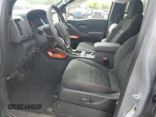 2023 Nissan Frontier Pro-4X with VIN 1N6ED1EK4PN672714, listed as a Copart auction lot 55557855 with 4,678 mi miles and Salvage title. Bid and sale history available at DreamBid. Image 7.