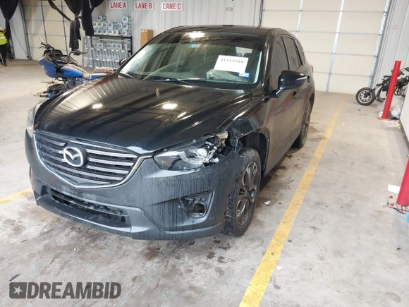 2016 Mazda CX-5 Grand Touring with VIN JM3KE2DY9G0705127, listed as a IAAI auction lot 41412910 with 181,993 mi miles. Bid and sale history available at carsss.com. Image 18.
