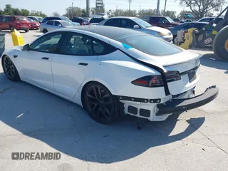 2022 Tesla Model S Plaid with VIN 5YJSA1E64NF484904, listed as a IAAI auction lot 41594464 with 25,299 mi miles and . Bid and sale history available at DreamBid. Image 3.