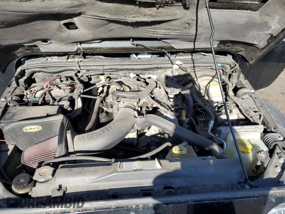 2009 Jeep Wrangler Rubicon with VIN 1J4GA64169L765933, listed as a Copart auction lot 84963104 with 107,190 mi miles and Salvage Title. Bid and sale history available at DreamBid. Image 12.