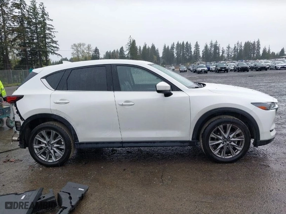 2021 Mazda CX-5 Grand Touring with VIN JM3KFBDM2M0357788, listed as a IAAI auction lot 41970254 with 56,153 mi miles. Bid and sale history available at carsss.com. Image 14.