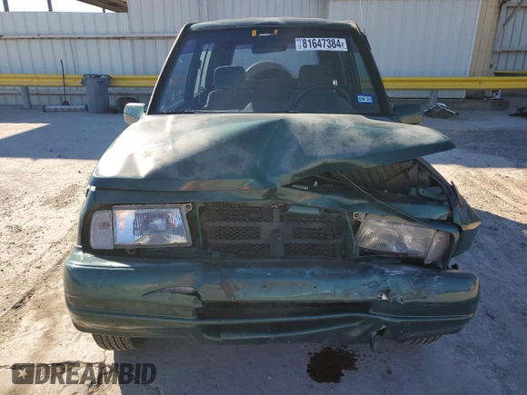 1996 Geo Tracker z VIN 2CNBE1363T6921541, wystawiony jako Copart lot #81647384 z przebiegiem 61 806 mil mil oraz Szkoda całkowita • Salvage title. Historia ofert i sprzedaży dostępna na DreamBid. Obrazek 5.