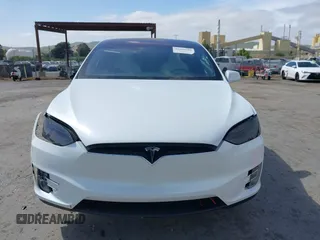 2021 Tesla Model X Long Range Plus with VIN 5YJXCBE23MF321243, listed as a IAAI auction lot 42100580 with 59,878 mi miles and . Bid and sale history available at carsss.com. Image 12.