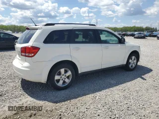 2013 Dodge Journey SE with VIN 3C4PDCAB3DT699816, listed as a Copart auction lot 52856455 with 67,688 mi miles and Salvage Title. Bid and sale history available at carsss.com. Image 3.