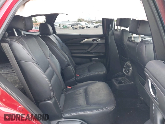 2020 Mazda CX-9 Grand Touring with VIN JM3TCBDY4L0423563, listed as a IAAI auction lot 41829394 with 76,704 mi miles and . Bid and sale history available at DreamBid. Image 8.