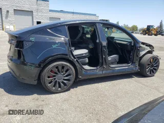 2022 Tesla Model Y Performance z VIN 7SAYGDEF2NF443037, wystawiony jako Copart lot #56870145 z przebiegiem 51 897 mil mil oraz Szkoda całkowita • Salvage title. Historia ofert i sprzedaży dostępna na DreamBid. Obrazek 3.