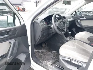 2018 Volkswagen Tiguan S with VIN 3VV1B7AX8JM032990, listed as a IAAI auction lot 42279807 with 74,185 mi miles and . Bid and sale history available at DreamBid. Image 18.
