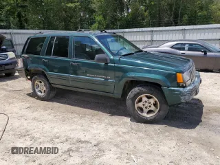 1998 Jeep Grand Cherokee Laredo with VIN 1J4GZ48S5WC289251, listed as a Copart auction lot 63594685 with 156,358 mi miles and Salvage title. Bid and sale history available at DreamBid. Image 4.