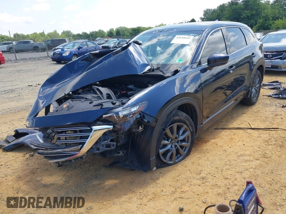 2022 Mazda CX-9 Touring z VIN JM3TCBCY7N0600370, wystawiony jako IAAI lot #42658049 z przebiegiem 113 000 mil mil oraz . Historia ofert i sprzedaży dostępna na DreamBid. Obrazek 2.