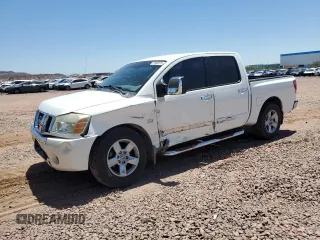2004 Nissan Titan LE with VIN 1N6AA07A74N557977, listed as a Copart auction lot 57858375 with 156,335 mi miles and Salvage title. Bid and sale history available at DreamBid. Image 1.