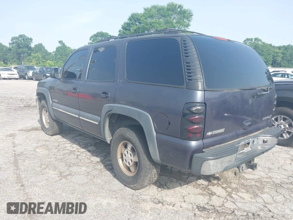 2002 Chevrolet Tahoe LS z VIN 1GNEC13ZX2R273935, wystawiony jako IAAI lot #42246472 z przebiegiem 205 995 mil mil oraz . Historia ofert i sprzedaży dostępna na DreamBid. Obrazek 3.