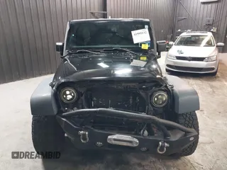 2015 Jeep Wrangler Unlimited Willys Wheeler with VIN 1C4BJWDG1FL749803, listed as a IAAI auction lot 41995132 with 156,595 mi miles and . Bid and sale history available at DreamBid. Image 6.