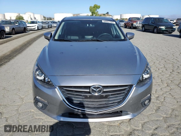 2015 Mazda 3 i Grand Touring z VIN JM1BM1M70F1260802, wystawiony jako Copart lot #60662705 z przebiegiem 89 974 mil mil oraz Szkoda całkowita • Salvage title. Historia ofert i sprzedaży dostępna na DreamBid. Obrazek 5.