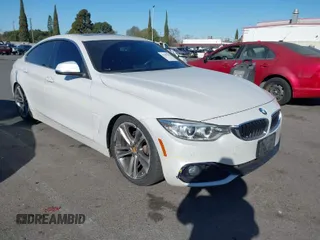 2016 BMW 4 Series 428i with VIN WBA4A9C5XGG507738, listed as a IAAI auction lot 41307995 with 74,801 mi miles. Bid and sale history available at carsss.com. Image 1.