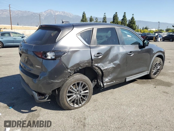 2020 Mazda CX-5 Touring with VIN JM3KFACM9L0815692, listed as a Copart auction lot 52431295 with 59,359 mi miles and Salvage Title. Bid and sale history available at DreamBid. Image 3.