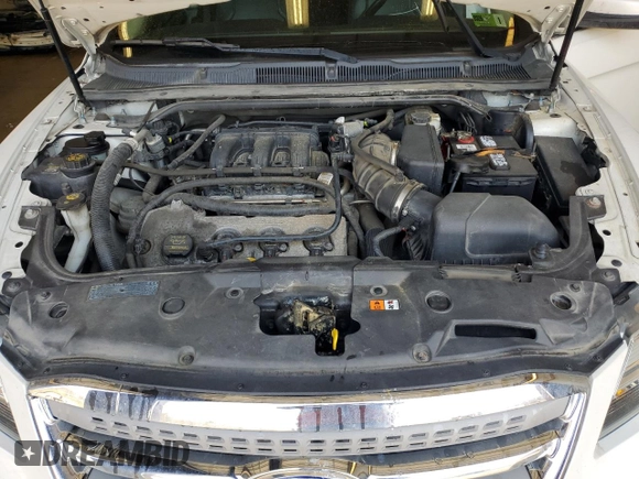 2012 Ford Taurus SEL z VIN 1FAHP2HW8CG133657, wystawiony jako Copart lot #52865895 z przebiegiem 132 876 mil mil oraz Szkoda całkowita • Salvage title. Historia ofert i sprzedaży dostępna na DreamBid. Obrazek 12.
