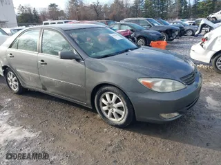 2003 Toyota Camry LE with VIN 4T1BE30K53U649007, listed as a IAAI auction lot 41030219 with 208,469 mi miles. Bid and sale history available at carsss.com. Image 1.