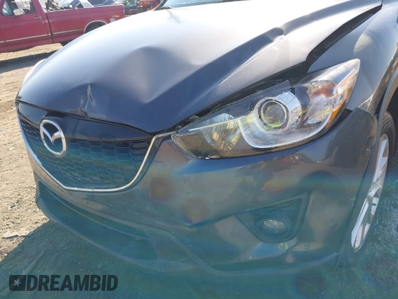 2014 Mazda CX-5 Grand Touring with VIN JM3KE4DY2E0312952, listed as a IAAI auction lot 42138721 with 99,993 mi miles and . Bid and sale history available at DreamBid. Image 6.