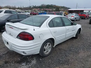 1999 Pontiac Grand Am SE1 with VIN 1G2NE52EXXM781713, listed as a IAAI auction lot 41914492 with 148,435 mi miles. Bid and sale history available at carsss.com. Image 4.