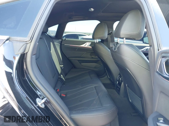 2024 BMW i4 eDrive35 z VIN WBY43AW01RFS94328, wystawiony jako IAAI lot #41734039 z przebiegiem 8 959 mil mil oraz . Historia ofert i sprzedaży dostępna na DreamBid. Obrazek 8.