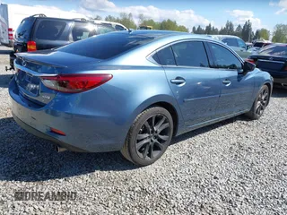 2016 Mazda Mazda6 i Grand Touring with VIN JM1GJ1W51G1436977, listed as a IAAI auction lot 42097363 with 128,941 mi miles. Bid and sale history available at carsss.com. Image 4.