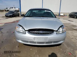 2003 Ford Taurus LX Standard z VIN 1FAFP52U93A159333, wystawiony jako Copart lot #78080944 z przebiegiem 54 652 mil mil oraz Szkoda całkowita • Salvage title. Historia ofert i sprzedaży dostępna na DreamBid. Obrazek 5.
