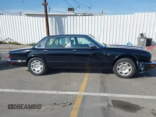 2003 Jaguar XJ 8 with VIN SAJDA14C03LF58706, listed as a IAAI auction lot 41619740 with 95,293 mi miles and . Bid and sale history available at DreamBid. Image 13.