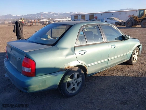 2001 Mazda Protege LX with VIN JM1BJ225310479705, listed as a IAAI auction lot 41456334 with 203,268 mi miles. Bid and sale history available at carsss.com. Image 4.
