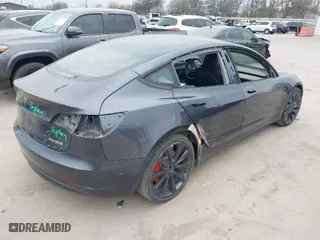 2022 Tesla Model 3 Performance with VIN 5YJ3E1EC9NF130410, listed as a IAAI auction lot 41711708 with 26,937 mi miles. Bid and sale history available at carsss.com. Image 4.