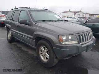 2004 Jeep Grand Cherokee Laredo with VIN 1J4GX48S14C177923, listed as a IAAI auction lot 41745772 with 242,506 mi miles. Bid and sale history available at carsss.com. Image 1.