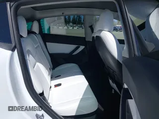 2022 Tesla Model Y Long Range z VIN 7SAYGDEE7NF418223, wystawiony jako IAAI lot #42046651 z przebiegiem 18 724 mil mil oraz . Historia ofert i sprzedaży dostępna na DreamBid. Obrazek 8.