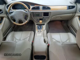 2002 Jaguar S-Type with VIN SAJDA01P12GM27242, listed as a Copart auction lot 88579215 with 218,546 mi miles and Salvage Title. Bid and sale history available at DreamBid. Image 8.