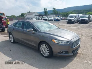 2014 Ford Fusion SE Hybrid with VIN 3FA6P0LU3ER152517, listed as a IAAI auction lot 42801042 with 209,898 mi miles and . Bid and sale history available at DreamBid. Image 1.