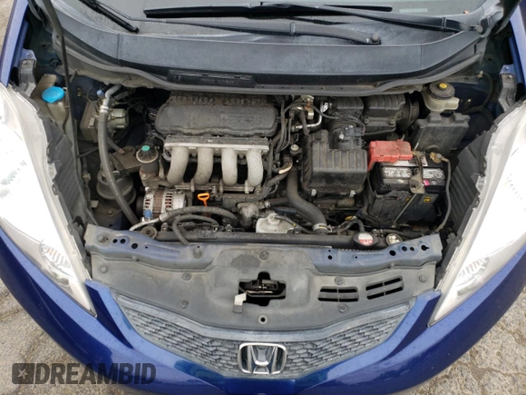 2009 Honda Fit Sport z VIN JHMGE88419S039797, wystawiony jako Copart lot #56866245 z przebiegiem 162 896 mil mil oraz Szkoda całkowita • Salvage title. Historia ofert i sprzedaży dostępna na DreamBid. Obrazek 11.