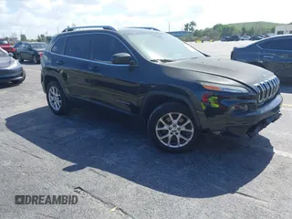 2015 Jeep Cherokee Latitude with VIN 1C4PJLCB4FW683904, listed as a IAAI auction lot 41579059 with 126,156 mi miles and . Bid and sale history available at carsss.com. Image 1.