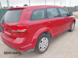 2014 Dodge Journey SE with VIN 3C4PDCAB2ET268532, listed as a IAAI auction lot 42056175 with 126,005 mi miles and . Bid and sale history available at carsss.com. Image 4.
