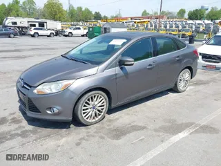 2012 Ford Focus SEL with VIN 1FAHP3H28CL282080, listed as a IAAI auction lot 42039926 with 134,785 mi miles. Bid and sale history available at carsss.com. Image 2.