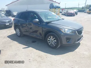2014 Mazda CX-5 Touring z VIN JM3KE4CY1E0391418, wystawiony jako IAAI lot #42090992 z przebiegiem 77 693 mil mil oraz . Historia ofert i sprzedaży dostępna na DreamBid. Obrazek 1.