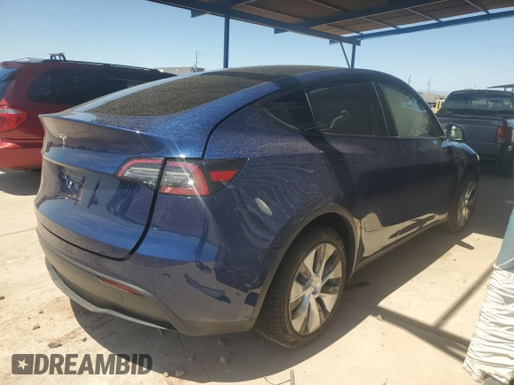2023 Tesla Model Y Long Range with VIN 7SAYGDEE7PA112865, listed as a Copart auction lot 54626685 with 10,720 mi miles and Salvage Title. Bid and sale history available at DreamBid. Image 3.