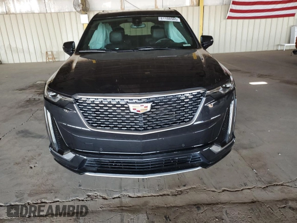 2020 Cadillac XT6 FWD Premium Luxury with VIN 1GYKPCRS8LZ149860, listed as a Copart auction lot 61108985 with 58,459 mi miles and Salvage title. Bid and sale history available at DreamBid. Image 5.