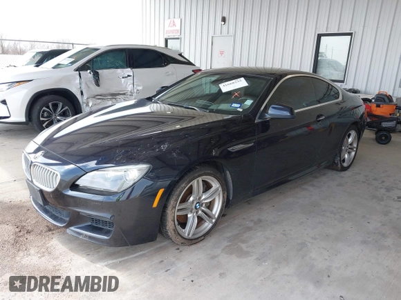 2012 BMW 6 Series 650i z VIN WBALX3C51CDV77602, wystawiony jako IAAI lot #41668235 z przebiegiem 103 684 mil mil oraz . Historia ofert i sprzedaży dostępna na DreamBid. Obrazek 17.