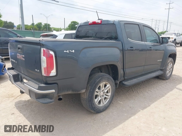 2019 GMC Canyon 4WD SLE z VIN 1GTG6CENXK1261278, wystawiony jako IAAI lot #42064295 z przebiegiem 51 786 mil mil oraz . Historia ofert i sprzedaży dostępna na DreamBid. Obrazek 4.