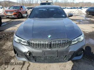 2020 BMW 3 Series M340i xDrive with VIN WBA5U9C02LFH17348, listed as a Copart auction lot 45452545 with 56,869 mi miles and Salvage Title. Bid and sale history available at DreamBid. Image 5.