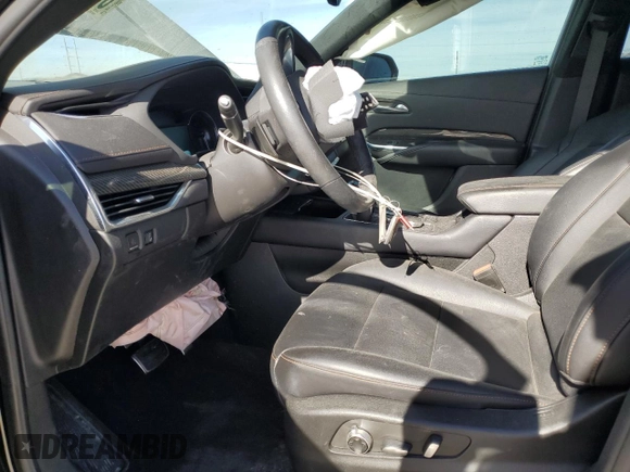 2023 Cadillac XT4 FWD Sport with VIN 1GYFZER47PF107311, listed as a Copart auction lot 87583565 with 26,585 mi miles and Salvage title. Bid and sale history available at DreamBid. Image 7.