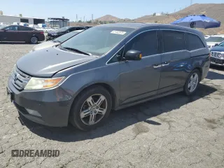 2012 Honda Odyssey Touring with VIN 5FNRL5H90CB145950, listed as a Copart auction lot 61492575 with 211,445 mi miles and Clean title. Bid and sale history available at DreamBid. Image 1.