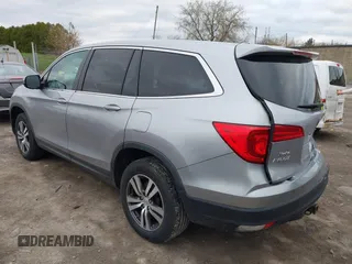 2017 Honda Pilot EX-L with VIN 5FNYF6H5XHB014067, listed as a IAAI auction lot 42083742 with 143,043 mi miles and . Bid and sale history available at DreamBid. Image 3.