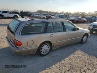 2000 Mercedes-Benz E-Class with VIN WDBJH65J4YB071699, listed as a Copart auction lot 75082144 with 105,989 mi miles and Salvage Title. Bid and sale history available at carsss.com. Image 3.