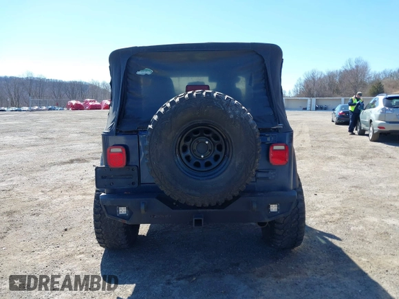 2003 Jeep Wrangler Sport with VIN 1J4FA49S03P343285, listed as a IAAI auction lot 41823684 with 201,723 mi miles and . Bid and sale history available at DreamBid. Image 17.